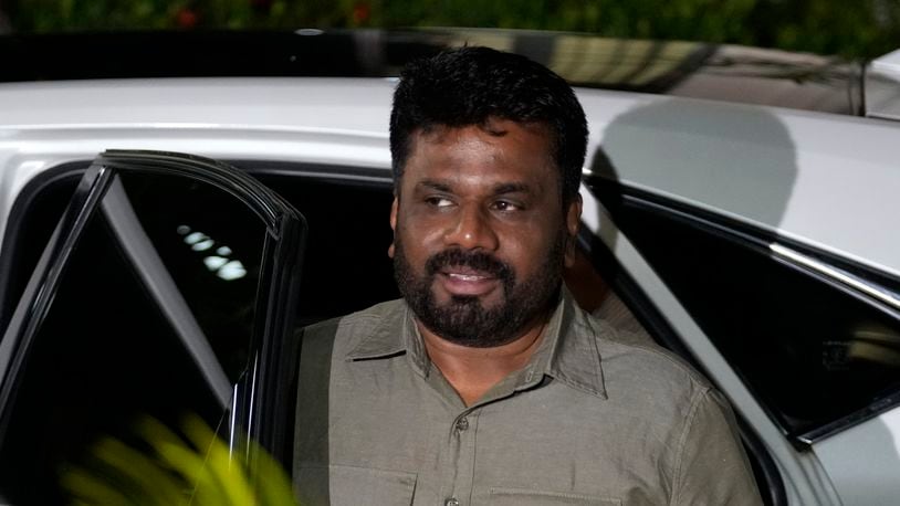 Marxist lawmaker Anura Kumara Dissanayake arrives at the election commission office after winning Sri Lankan presidential election, in Colombo, Sri Lanka, Sunday, Sept. 22, 2024. (AP Photo/Eranga Jayawardane)