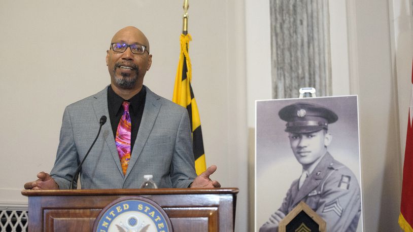 Steve Woodson offers remarks during a ceremony to posthumously award the Distinguished Service Cross to his father, U.S. Army Staff Sgt. Waverly Woodson Jr., a medic who was part of the only Black combat unit to take part in the D-Day invasion of France during World War II, on Capitol Hill, in Washington, Tuesday, Sept. 24, 2024. (AP Photo/Rod Lamkey, Jr.)