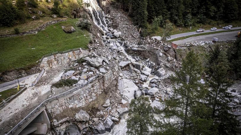 A road is blocked in Saasal, Switzerland, Friday, Sept. 5, 2024, after a landslide following severe weather. (Andrea Soltermann/Keystone via AP)