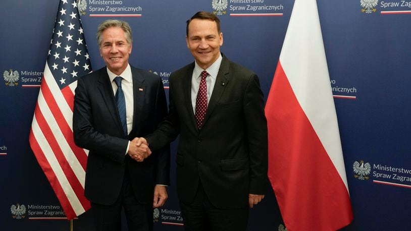 U.S. Secretary of State Antony Blinken, left, welcomes by Polish Foreign Minister Radosław Sikorski, right, for talks in Warsaw, Poland, Thursday, Sept. 12, 2024. (AP Photo/Czarek Sokolowski)