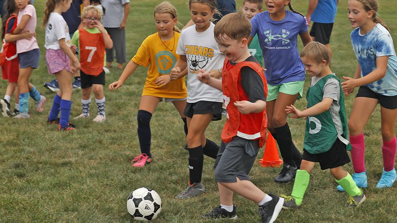 Dream Soccer players in the younger age group practice Thursday, August 15, 2024 at National Trail Soccer Complex for the 18th Annual Tournament on Friday. BILL LACKEY/STAFF