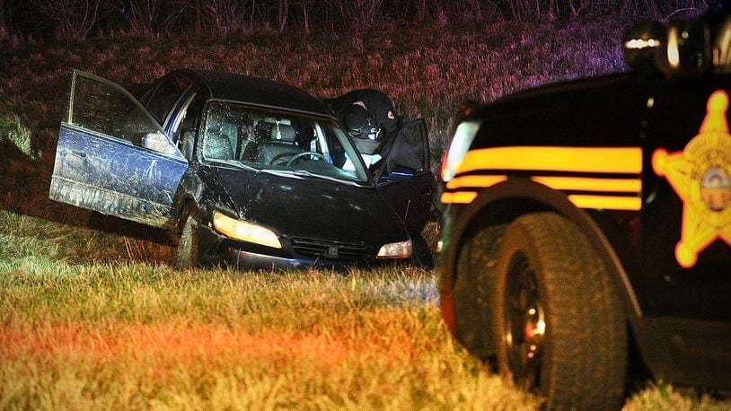 A pursuit with a person of interest from a stabbing in Mad River Township ends in a crash on the exit ramp from north route 68 to US 40 Sunday March 17, 2024. A driver, his girlfriend, and a three-year-old child were in the car involved in the crash. MARSHALL GORBY \STAFF