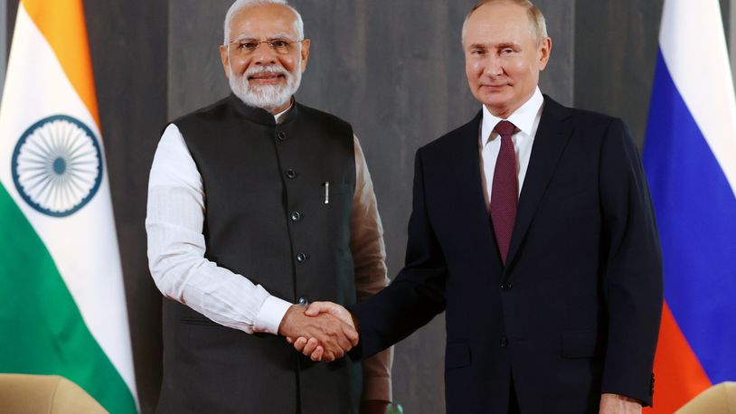 FILE -Russian President Vladimir Putin, right, and Indian Prime Minister Narendra Modi pose for a photo shaking hands prior to their talks on the sidelines of the Shanghai Cooperation Organisation (SCO) summit in Samarkand, Uzbekistan, Sept. 16, 2022. The Kremlin on Thursday said Modi will visit Russia on July 8-9 and hold talks with Putin. The visit was first announced by the Russian officials last month, but the dates have not been previously disclosed. (Alexandr Demyanchuk, Sputnik, Kremlin Pool Photo via AP, File)