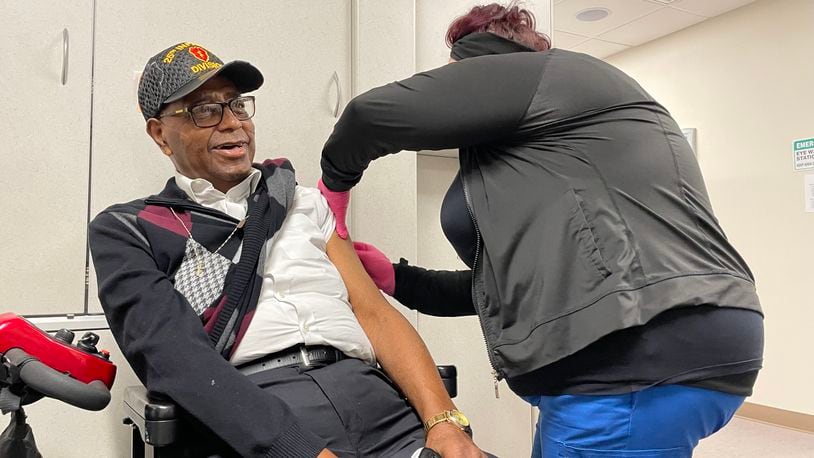 Former Springfield police chief Roger Evans gets his second booster during a vaccine clinic at Rocking Horse in Springfield on Friday.