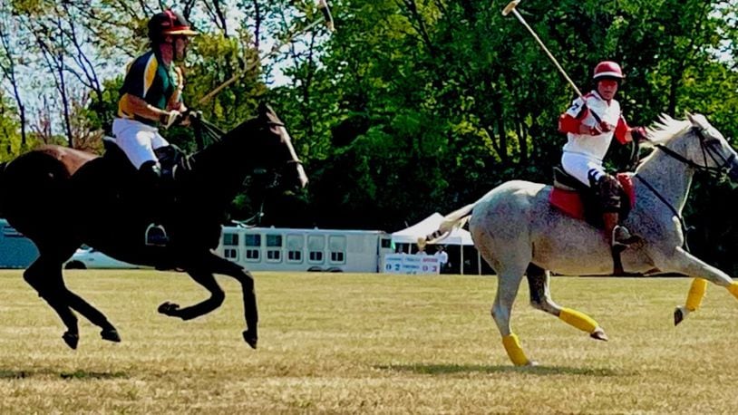 Casey Koehler (left) riding for Springfield in hot pursuit of Keith Potter (right) of Cincinnati, in the Springfield Polo Club’s 100th anniversary match. Contributed