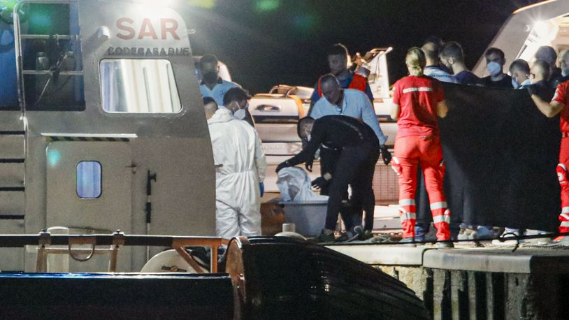 The bodies of some of the 64 migrants missing in the Mediterranean Sea after their ship wrecked off Italy's southern coast are disembarked at the Italian southern port-city of Roccella Ionica, early Wednesday, June 19, 2024. U.N. agencies said the boat that wrecked off Calabria had set off from Turkey eight days earlier and caught fire and overturned. Eleven people were rescued Monday, but one died soon after they were brought to land. (AP Photo/Valeria Ferraro)