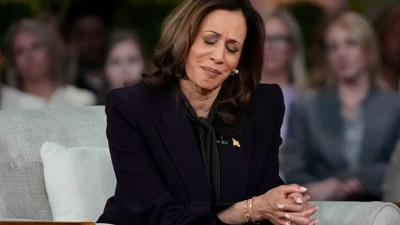 Democratic presidential nominee Vice President Kamala Harris listens to a parent's survivor story as she joins Oprah Winfrey at Oprah's Unite for America Live Streaming event Thursday, Sept. 19, 2024 in Farmington Hills, Mich. (AP Photo/Paul Sancya)