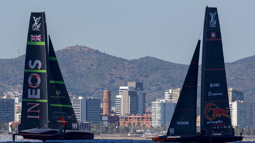 Ineos Britannia's AC75, left, and Alinghi Red Bull Racing's AC75 boats sail during a semi-final America's Cup Regatta ahead of the 37th America's Cup sailing race along the Barcelona's coast, Spain, Saturday, Sep. 14, 2024. (AP Photo/Joan Monfort)