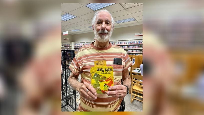 Erin Dechaene checked out a book in 1983 from the old New Carlisle library when he was eight years old, and his father Kendall recently found it and returned it to the library 40 years later. Contributed