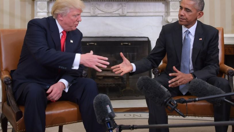 Former President Barack Obama and Republican President-elect Donald Trump shake hands during a transition planning meeting in the Oval Office at the White House on Nov. 10, 2016 in Washington, D.C.