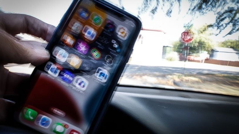 The distracted driving warning period ends today Oct. 4, 2023. Starting Thursday, Oct. 5, 2023, Ohio law enforcement officers can issue tickets for distracted driving  such as talking or texting on a cell phone as a primary offense.  PHOTO ILLUSTRATION/ JIM NOELKER/STAFF