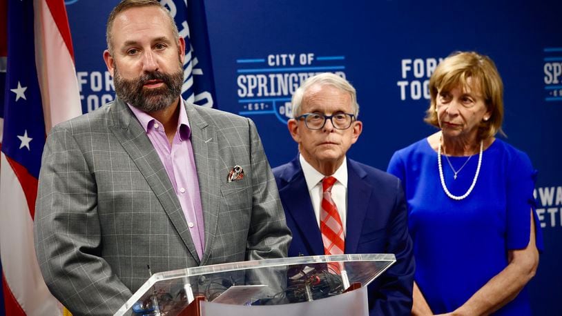 Springfield schools  Superintendent Bob Hill, with Ohio Governor Mike DeWine, and his wife Fran, answer questions at a press conference Tuesday, September 17, 2024 at City Hall in Springfield.  MARSHALL GORBY \STAFF