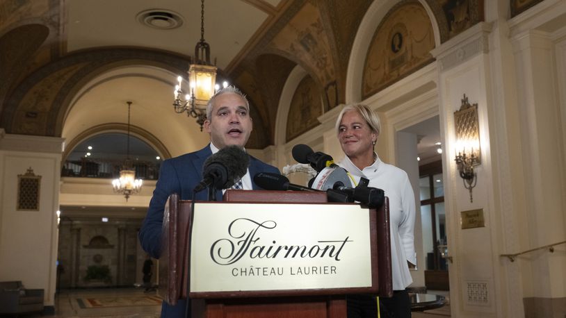 Fairmont Chateau Laurier General Manager Genevieve Dumas looks on as Ottawa Police Services Detective Akiva Gellar speaks about the stolen Yousuf Karsh portrait of Winston Churchill, during a news conference in the hotel in Ottawa, Canada, Wednesday, Sept. 11, 2024. (Adrian Wyld/The Canadian Press via AP)