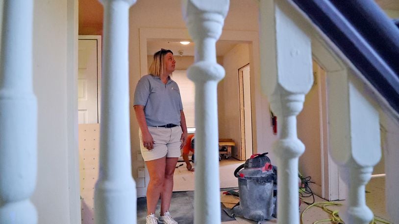 Elaina Bradley looks over the renovations going on inside Sheltered Inc. Friday, July 1, 2022. BILL LACKEY/STAFF