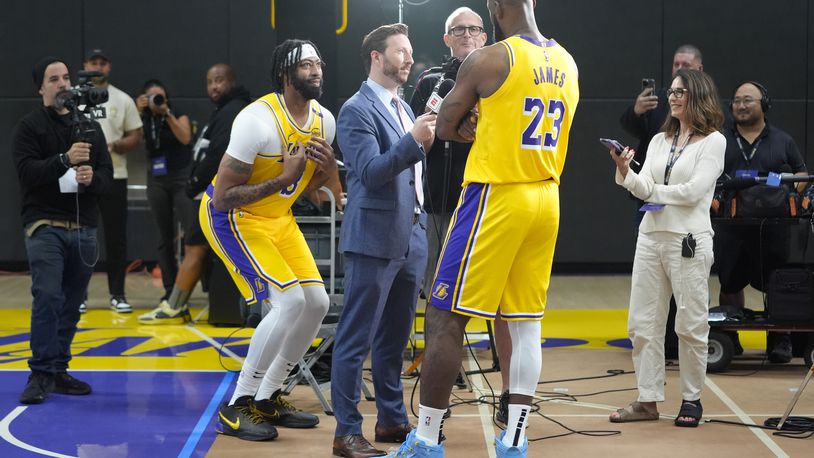 Los Angeles Lakers' Anthony Davis, left, jokes around as LeBron James participates in an interview during the NBA basketball team's media day in El Segundo, Calif., Monday, Sept. 30, 2024. (AP Photo/Jae C. Hong)