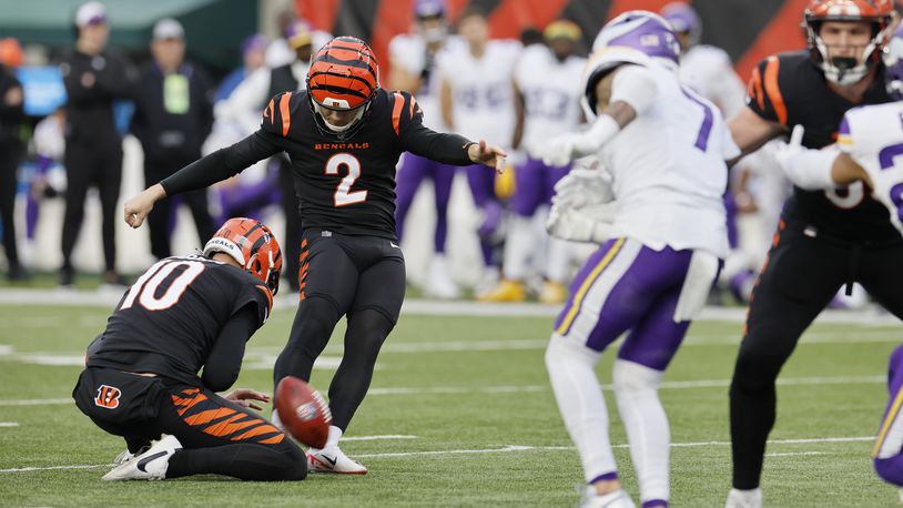 Cincinnati Bengals place kicker Evan McPherson (2) kicks the game-winning field goal in overtime of an NFL football game against the Minnesota Vikings Saturday, Dec. 16, 2023, in Cincinnati. (AP Photo/Jay LaPrete)