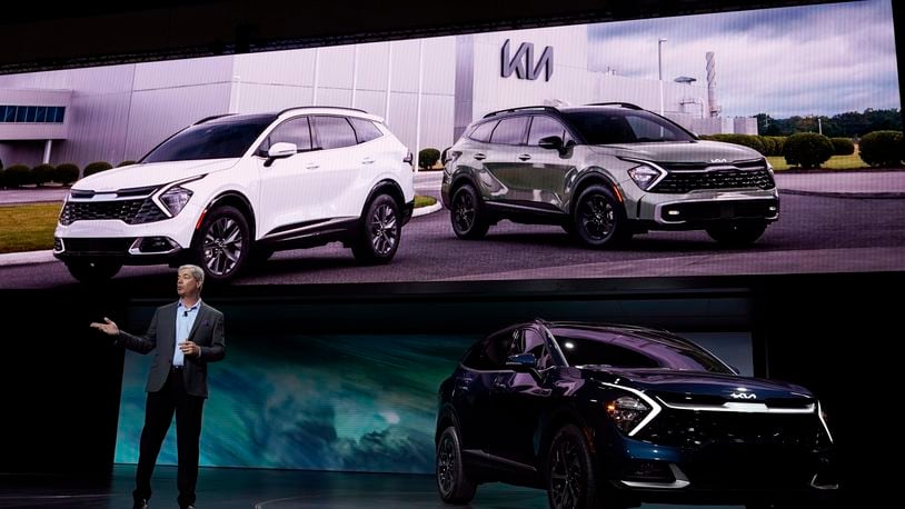 Russell Wager, Vice President of Marketing for Kia America, introduces the Kia Sportage HEV at the AutoMobility LA auto show Wednesday, Nov. 17, 2021, in Los Angeles. (AP Photo/Marcio Jose Sanchez)
