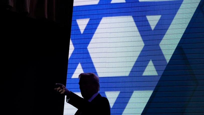 Republican presidential nominee former President Donald Trump acknowledges the crowd as he exits the stage after speaking at the Israeli American Council National Summit, Thursday, Sept. 19, 2024, in Washington. (AP Photo/Evan Vucci)