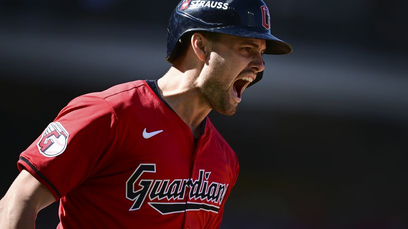 Cleveland Guardians' Lane Thomas shouts as he runs the bases after hitting a home run in the first inning during Game 1 of baseball's AL Division Series against the Detroit Tigers, Saturday, Oct. 5, 2024, in Cleveland. (AP Photo/David Dermer)