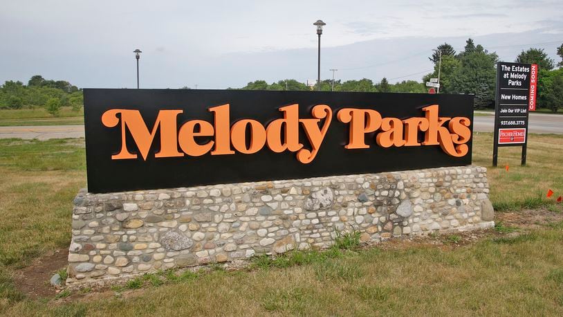 A new permanent Melody Parks development sign has replaced the old NextEdge sign along U.S. 40 Friday, July 5, 2024. BILL LACKEY/STAFF