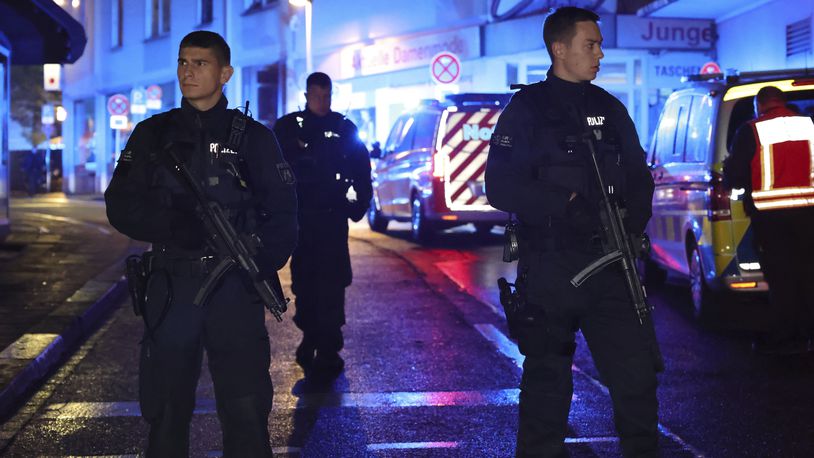 Police and ambulances near the scene where people were killed and injured in an attack at a festival in Solingen, western Germany, the German dpa news agency reported, Friday, Aug. 23, 2024. (Gianni Gattus/dpa via AP)