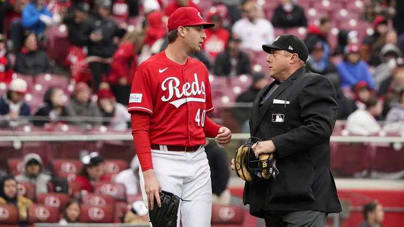 Photos: Reds, Pirates scuffle in the fourth inning on Sunday