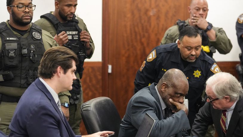 Former Houston police officer Gerald Goines sits in the courtroom after he was sentenced to 60 years behind bars on a pair of felony murder convictions on Tuesday, Oct. 8, 2024, in Houston. Goines was found guilty of felony murder in the 2019 deaths of Dennis Tuttle and Rhogena Nicholas. (Brett Coomer/Houston Chronicle via AP)