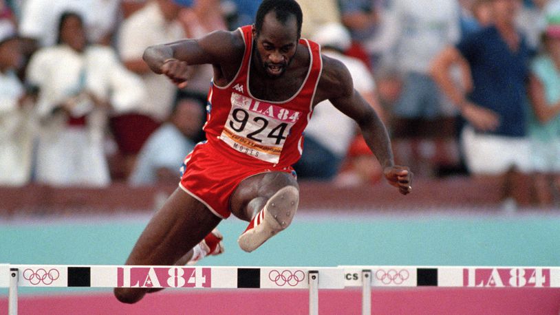 FILE - United States' Edwin Moses jumps a hurdle on his way to winning the gold medal in the 400-meter hurdles at the Summer Olympic Games in Los Angeles, Aug. 5, 1984. (AP Photo/File)