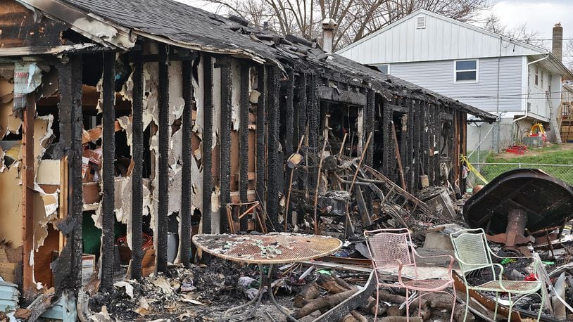 The rear view of the house at 618 Bowser Street shows the extent of the damage Monday after a fire on Sunday destroyed most of the home. BILL LACKEY/STAFF