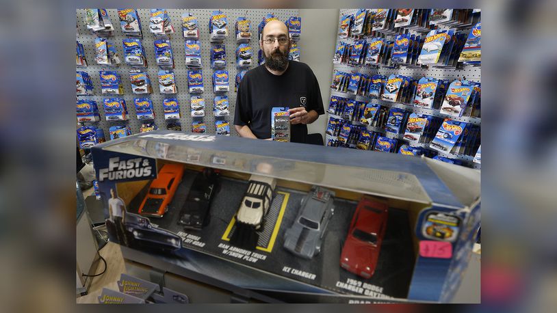 Robert Carter, the owner of Carters' Junk Drawer in New Carlisle, has a little bit of everything in his shop but most of the inventory centers around Hot Wheels cars. Carter's has been open for nearly three years but has recently moved around the corner to Washington Street. BILL LACKEY/STAFF