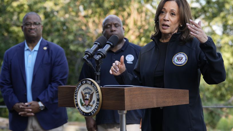 Democratic presidential nominee Vice President Kamala Harris speaks as she tours an area impacted by Hurricane Helene in Augusta, Ga., Wednesday, Oct. 2, 2024, as Augusta Mayor Garnett Johnson, left, and FEMA deputy director Erik Hooks listen. (AP Photo/Carolyn Kaster)