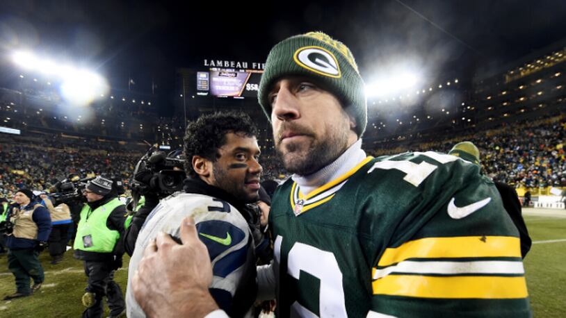 Russell Wilson, left, meets with Aaron Rodgers after the Green Bay Packers beat the Seattle Seahawks 38-10 at Lambeau Field in 2016.