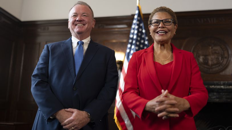 Los Angeles Mayor Karen Bass, right, and newly appointed police chief Jim McDonnell share a light moment during a news conference in Los Angeles, Friday, Oct. 4, 2024. (AP Photo/Jae C. Hong)