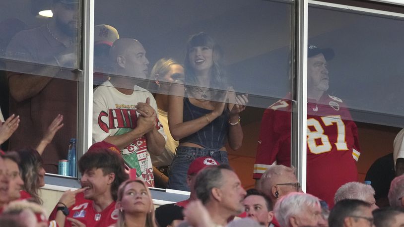 Taylor Swift is seen in a suite before the start of an NFL football game between the Kansas City Chiefs and the Baltimore Ravens Thursday, Sept. 5, 2024, in Kansas City, Mo. (AP Photo/Ed Zurga)