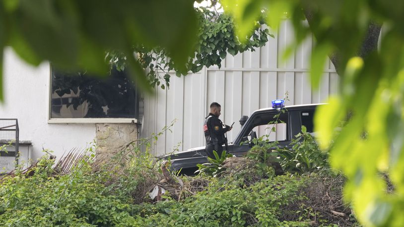 Police guard Argentina's embassy in Caracas, Venezuela, Saturday, Sept. 7, 2024. (AP Photo/Ariana Cubillos)