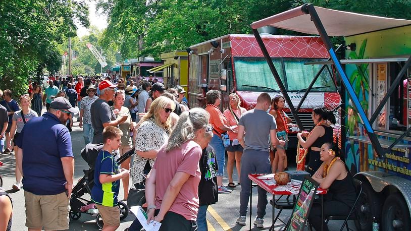 A crowd of hungry people filled Veterans Park Saturday, August 17, 2024 for the 10th annual Springfield Rotary Gourmet Food Truck Competition. BILL LACKEY/STAFF