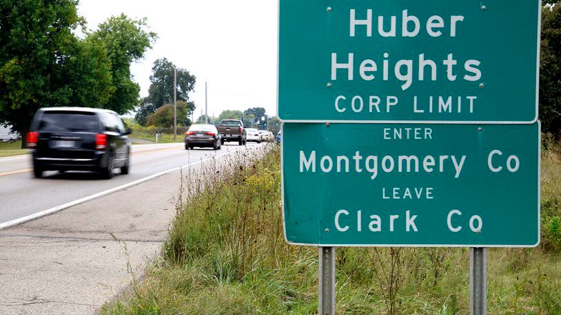Cars past a sign marking the Huber Heights Corp. Limit along Ohio Route 235 north of Interstate 70 near where the future Buc-ee's will be located. BILL LACKEY/STAFF