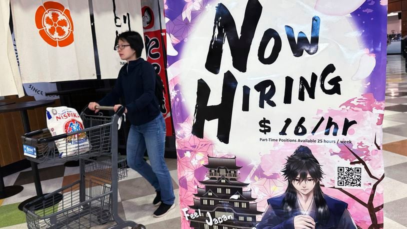 A hiring sign is displayed at a restaurant in Arlington Heights, Ill., Friday, June 28, 2024. On Tuesday, July 2, 2024, the Labor Department reports on job openings and labor turnover for May. (AP Photo/Nam Y. Huh)