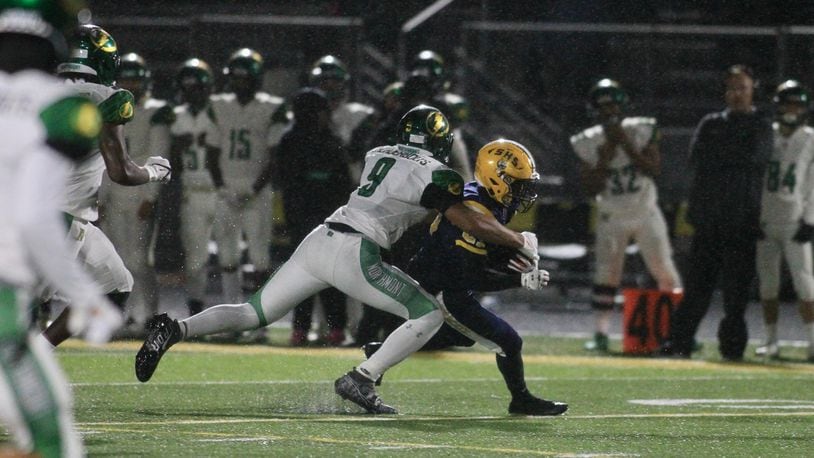 Northmont's Nigel Glover makes a tackle against Springfield on Oct. 22, 2021, at Springfield High School. David Jablonski/Staff