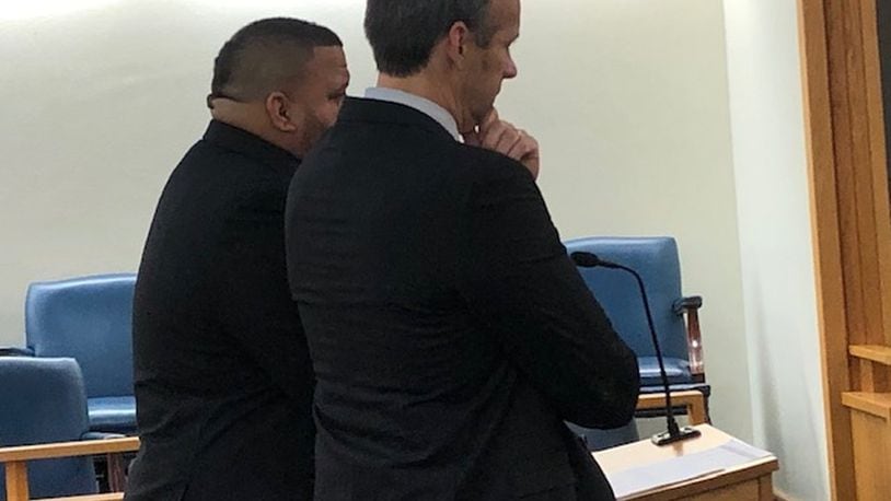 Springfield officer Joseph Robinson is on administrative leave after being charged with an OVI following a traffic stop last week. Here, Robinson (left) with his attorney Paul Kavanaugh (right) when he was charged with an OVI in 2019. STAFF