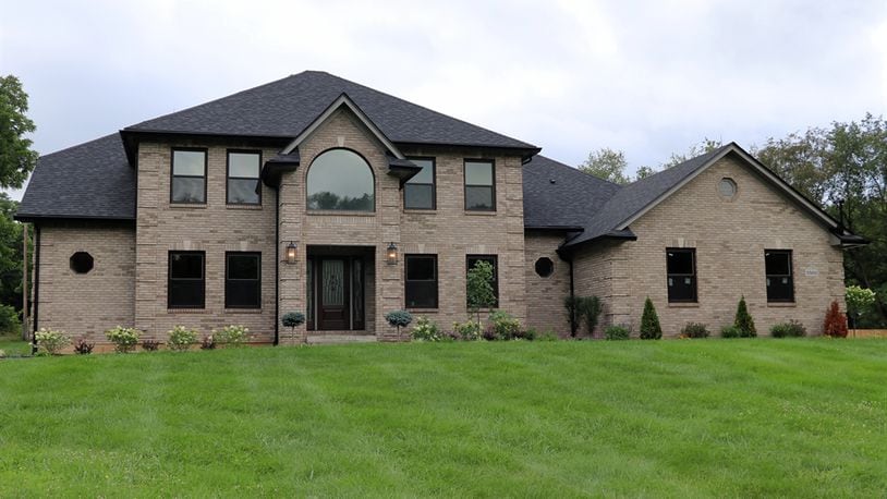 Located within a pocket cul-de-sac along the Stillwater River banks, the brick two-story at 5500 Beejay Court has about 4,892 square feet of living space including the finished walk-out basement. Listed for $750,000 by Home Experts Realty, the secluded 1.2-acre property has a tree-lined and wood privacy-fenced back yard and includes a new storage barn with covered porch. CONTRIBUTED