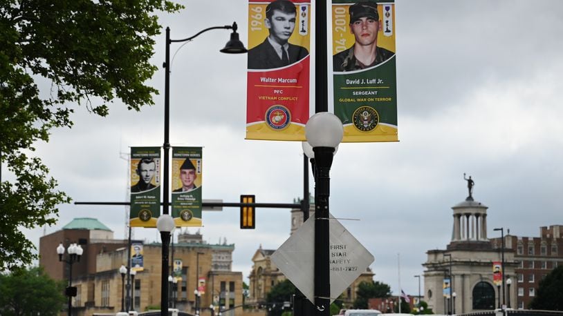 The class of 2024 Hamilton's Hometown Hero banner program features 230 new banners around the city. With the 126 banners from 2023, more than 350 veterans and active service men and woman are honored. Pictured are the banners of Marine Private 1st Class Walter Marcum and Army Sgt. David Luff Jr. banner on the High-Main Bridge. The 19 on the bridge were killed in action in service to the country. MICHAEL D. PITMAN/STAFF