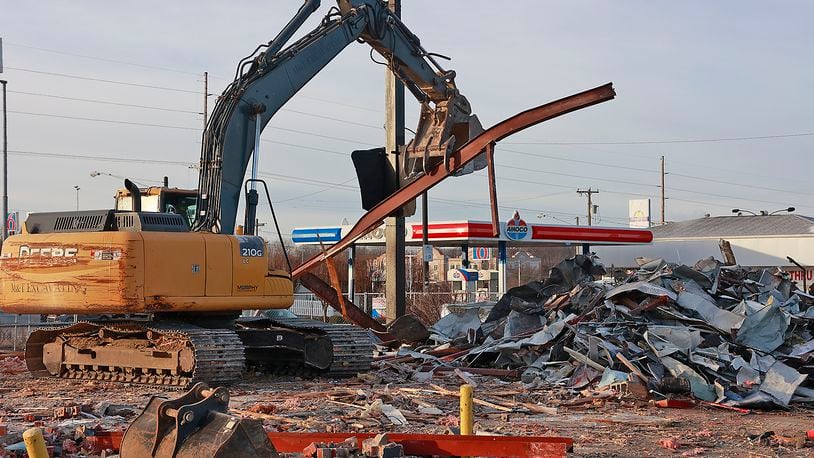 A demolition crew sorts through and cuts up the pieces of the Hardee's restaurant on South Limestone Street in Springfield Monday, Dec. 19, 2022. A second Springfield Chipotle restaurant is planned for the site. BILL LACKEY/STAFF