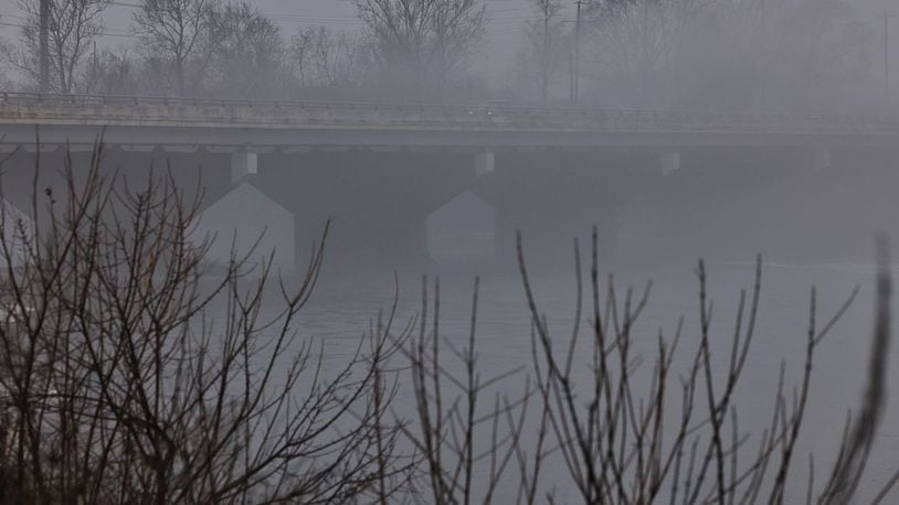 Morning fog caused decreased visibility around the county Wednesday morning, Jan. 24, 2024. This is the Oxford State Road bridge crossing the Great Miami River. NICK GRAHAM/STAFF