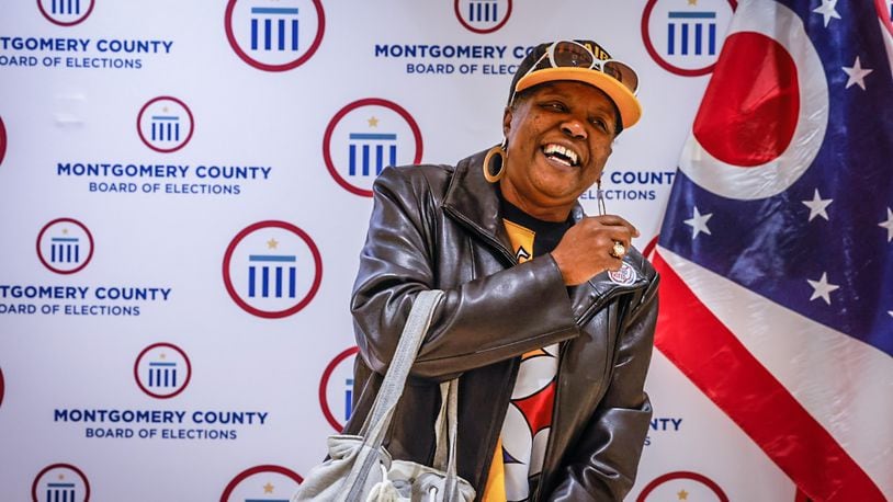 After voting early at the Montgomery County Board of Elections, Darla Jackson-Jones is photographed by Jeff Hoagland, not pictured, on Friday April 28, 2023. JIM NOELKER/STAFF