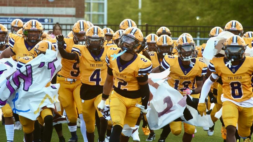 Springfield takes the field before a game against Winton Woods on Friday, Aug. 23, 2024, in Springfield. David Jablonski/Staff