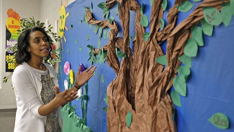 Melinda Clark, a math teacher at Roosevelt Middle School, explains how the learning tree works in her classroom. If a student gets a “C” or above they can put a leaf on the tree with their name on it. Clark is one of this year’s Teachers of the Year. Bill Lackey/Staff
