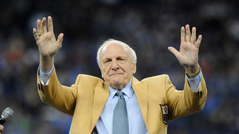 FILE - Detroit Lions head coach Joe Schmidt acknowledges the crowd after receiving a Pro Football Hall of Fame ring during a ceremony at halftime of an NFL football game between the Detroit Lions and the Chicago Bears, Oct. 18, 2015, in Detroit. (AP Photo/Jose Juarez, File)