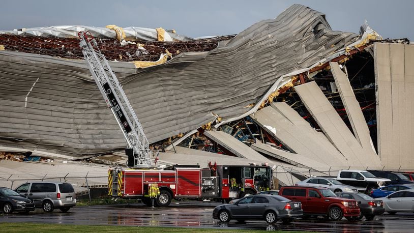 Firefighters are shown near the damage at the Meijer Distribution Center in Tipp City near Interstate 75 after a tornado struck the area on Wednesday, June 8, 2022. JIM NOELKER/STAFF