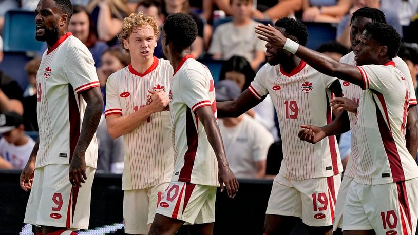 Canada forward Jacob Shaffelburg, second from left, celebrates with teammates after scoring a goal during the first half of an international friendly soccer game against United States, Saturday, Sept. 7, 2024, in Kansas City, Mo. (AP Photo/Charlie Riedel)